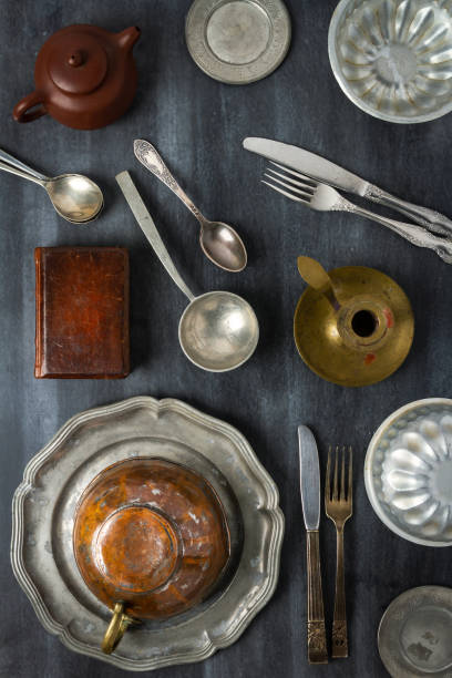 istock Various antique vintage dishes on black background 1795170910