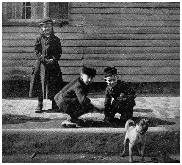 istock Antique image of Hampden County, Massachusetts: Springfield, Children playing marbles in Worthington Street 1795171737