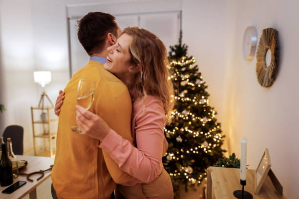 istock Young couple bonding during Christmas eve at home 1795172485