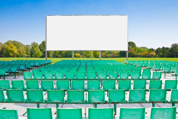 istock Outdoor cinema with chairs and white projection screen 1795205086