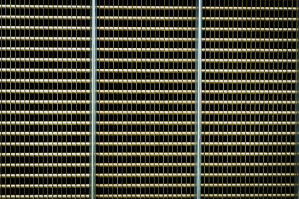 Mesh machine. Radiator grille. Metal texture. Gray grid metal pattern texture or industrial background