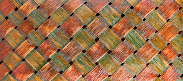 close-up colorful old wicker basket detail.Geometric background