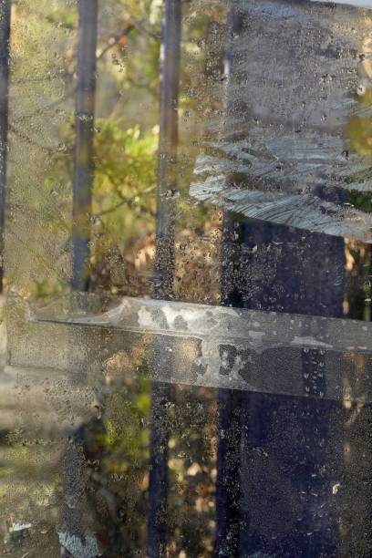 istock Raindrops on an old dirty glass in street 1795214832