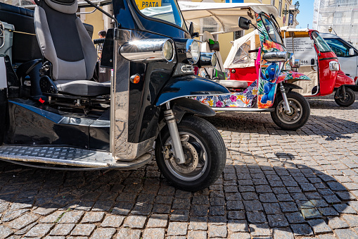 Tricycle and Cityscape around Lisbon Cathedral, Portugal.