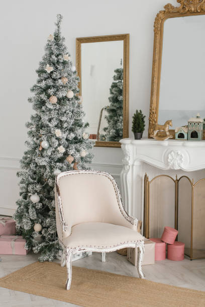 istock Classic Christmas New Year interior is decorated with a Christmas tree. Christmas tree with gold and white decorations. 1795219841