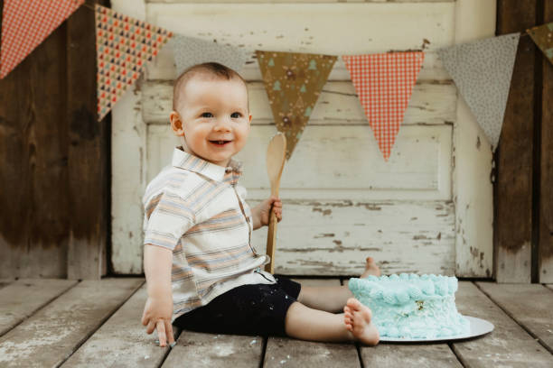 istock Baby Boy With His First Birthday Cake 1795227451