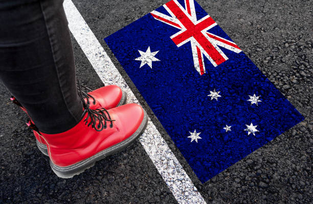 istock womman  standing  next to flag of Australia 1795231426