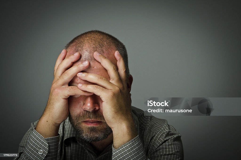 Man in thoughts Headache. Expressions, feelings and moods. Man suffering from headache Adult Stock Photo