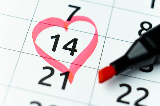 14 february marked with heart in calendar with red marker. St. Valentines day, anniversary. Close up