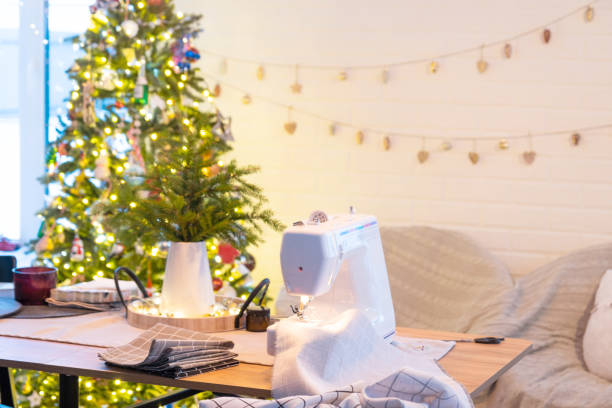 istock Sewing process on a sewing machine, a needle with a thread and a holder close-up stitch the white checkered fabric. Preparation for Christmas and new year, textiles for cozy in festive decor interior 1795255404