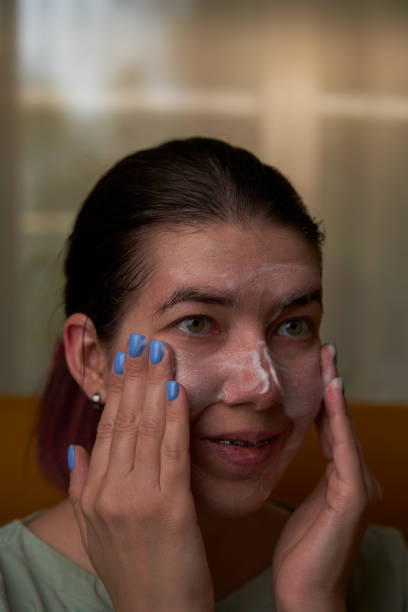 istock Woman is using foam to wash on the face. 1795257114