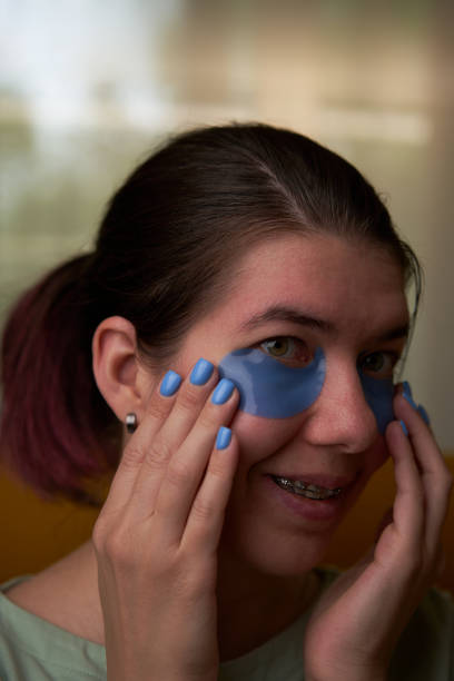 istock Woman is using cosmetic patches on face. 1795261092