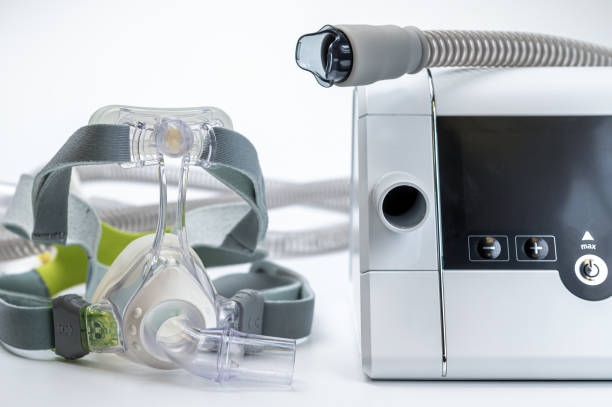 istock Continuous positive airway pressure system includes of CPAP machine, mask, tube on white background. 1795263885