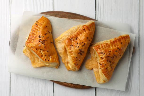 istock Fresh delicious puff pastry on white wooden table, top view 1795270529