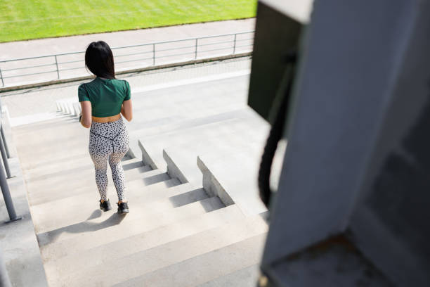 istock Healthy Lifestyle: Woman Running at the Stadium 1795271052