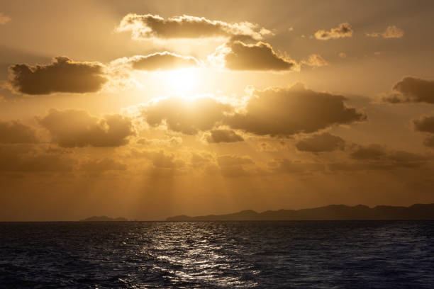 sunset over kerama islands, okinawa, japan beutiful sunbeam sunset over kerama islands silhouette in okinawa prefecture in japan. japanese angel stock pictures, royalty-free photos & images