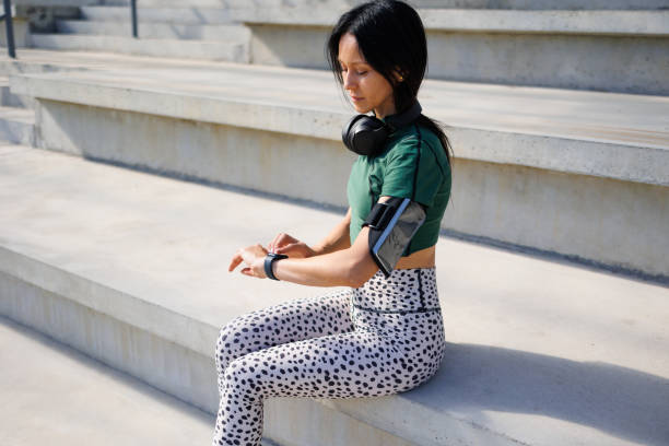 istock Time Check: Sporty Brunette in Stadium 1795272715