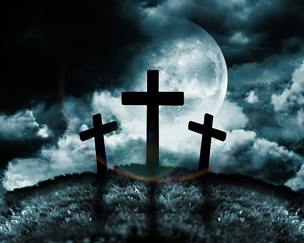 istock Silhouette of three crosses on a hill 179527467