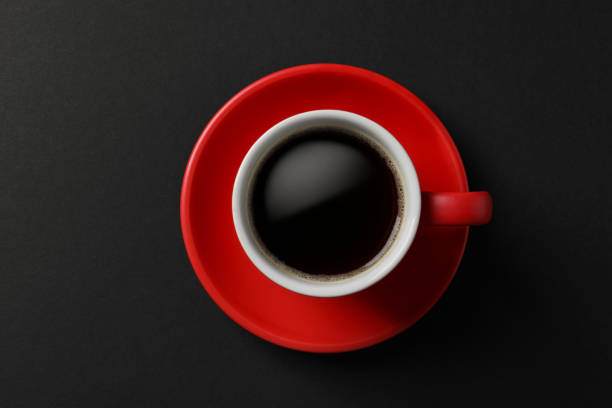 istock Cup with aromatic coffee on black background, top view 1795275980