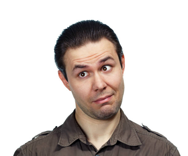 Young surprised man looking aside, emotional portrait on white background