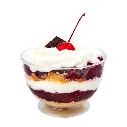 Dessert based on vanilla sponge cake, curd cream and cherries isolated on white