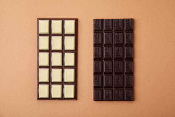 istock Tasty chocolate bars on brown background, flat lay 1795287540