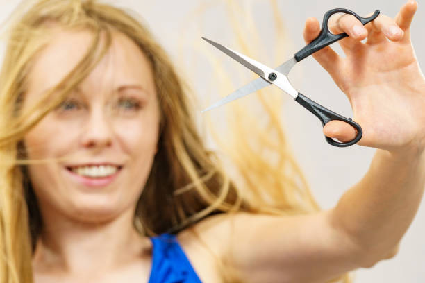 istock Woman with scissors ready to hair cutting 1795298886