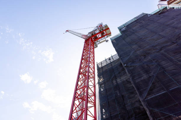 istock Construction of skyscrapers with tower crane, sky background with copy space 1795302075