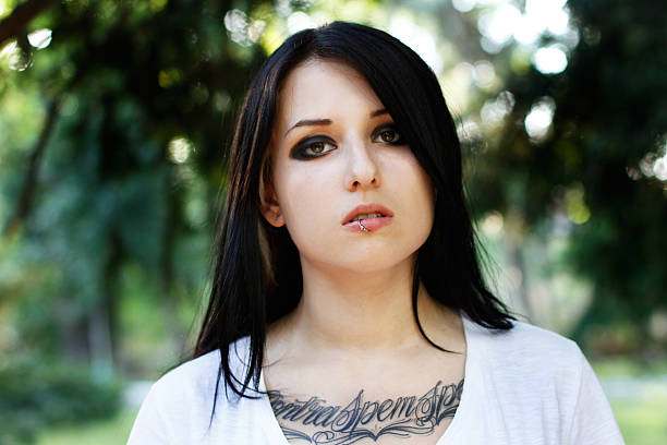 istock Young girl with piercing and tattoo 179530806