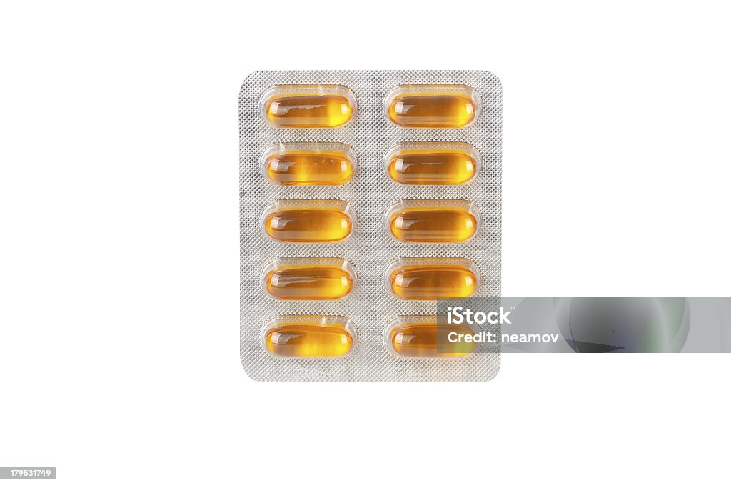 Comprimidos en blíster como telón de fondo - Foto de stock de Amarillo - Color libre de derechos