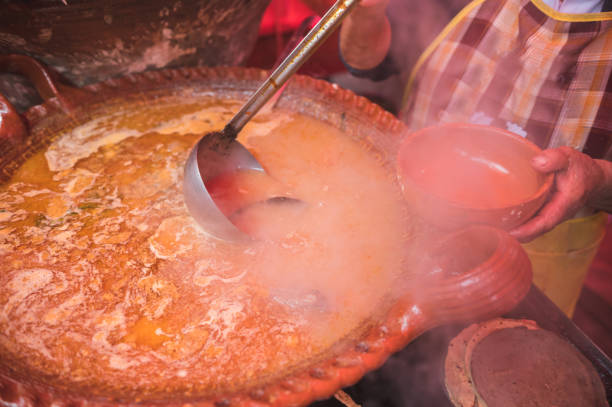 Tacos and lamb barbecue consomme sold in a Mexican market.