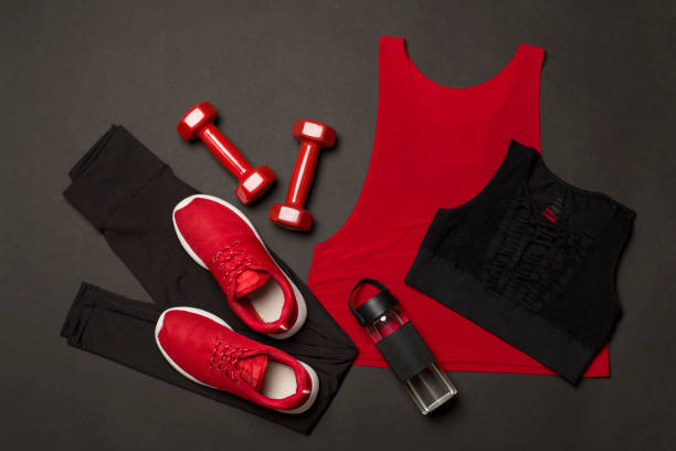 istock Black gym outfit on color background, top view 1795331663