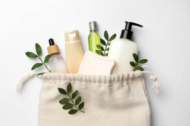 istock Preparation for spa. Compact toiletry bag, twigs and cosmetic products on white background, flat lay 1795338531