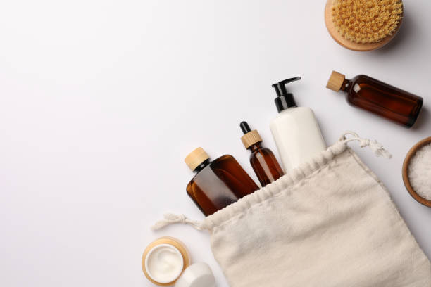 istock Preparation for spa. Compact toiletry bag and cosmetic products on white background, flat lay. Space for text 1795339060