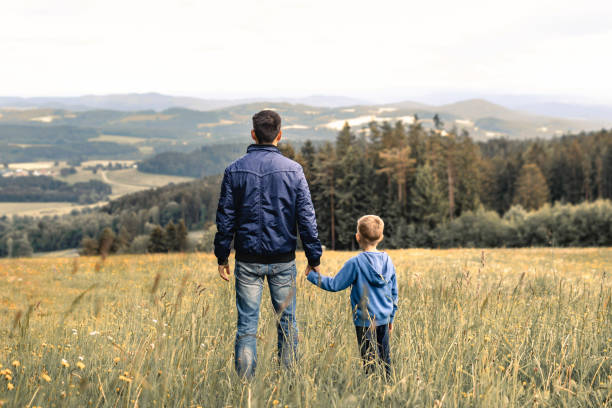 istock Father and son looking at beautiful view. 1795341352