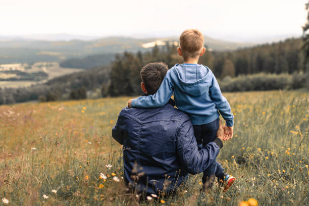 Father and son bonding together in beautiful natural settings.
