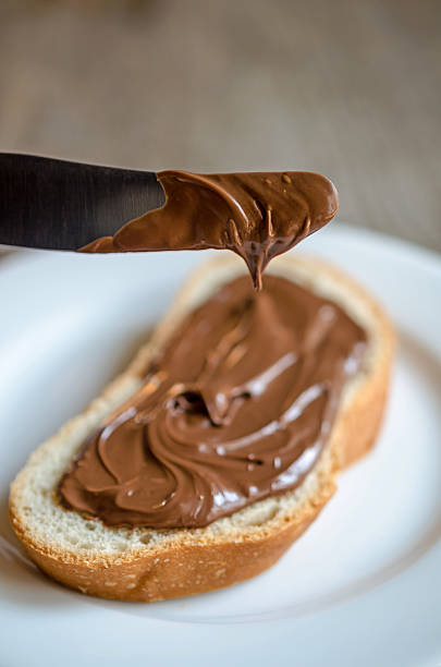 istock A slice of bread with chocolate spread and a knife 179534603