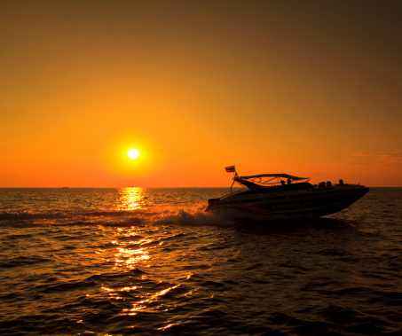 Sunset sea and boat Koh Phi Phi thailand