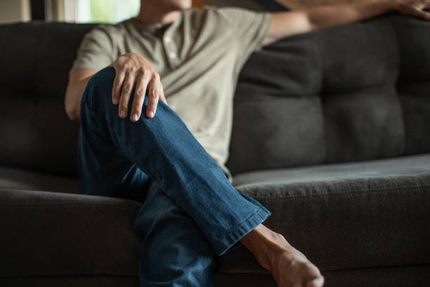 istock Men relaxing on the couch at home. Day off. 1795356939