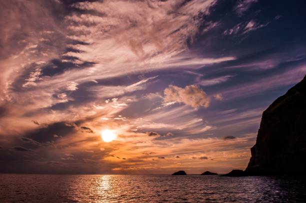 istock a beautiful sunset is shining brightly over the ocean in this view 1795360908