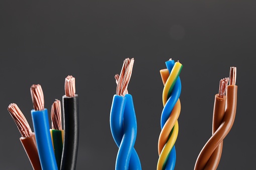 New colorful electrical wires on gray background