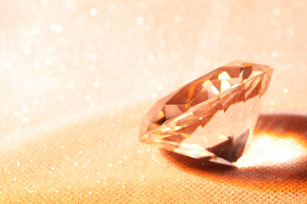 istock Beautiful dazzling diamond on beige glitter fabric, space for text 1795361066