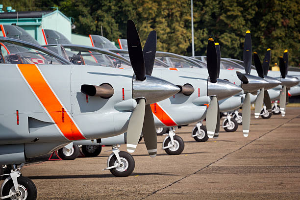 Row of single engine propeller Airplanes