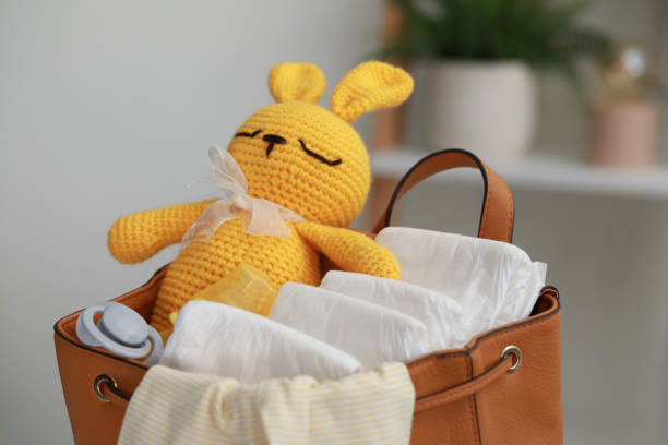 istock Mother's bag with baby's stuff indoors, closeup 1795377552