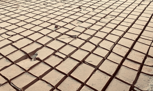 Dried mud cut in square blocks - Stock Image as JPG File