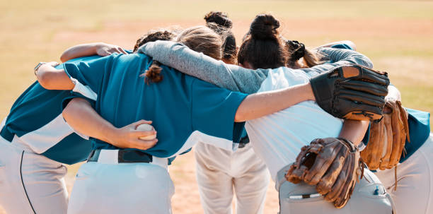 istock Baseball, support and team together in a motivation, game and training on a pitch or field, Women athlete or club with teamwork, collaboration and  conversation in a sports match outdoor in summer 1795382709