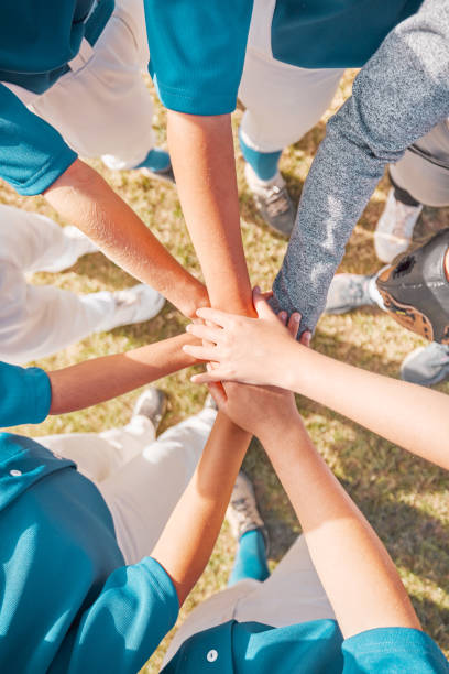 istock Support hands, team motivation and sports baseball game on field, collaboration in teamwork and people with trust at sport event. Athlete with solidarity and faith together as team for competition 1795382719