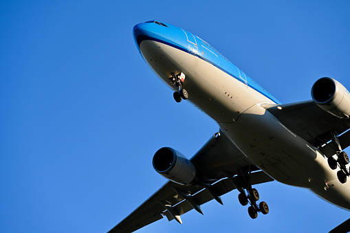 Airplane flying towards the clouds.