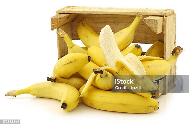 Fresh Bananas And A Peeled One Stock Photo - Download Image Now - Banana, Wood - Material, Crate