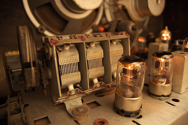 Inside view of the antique dusty components of1958 tube radio.